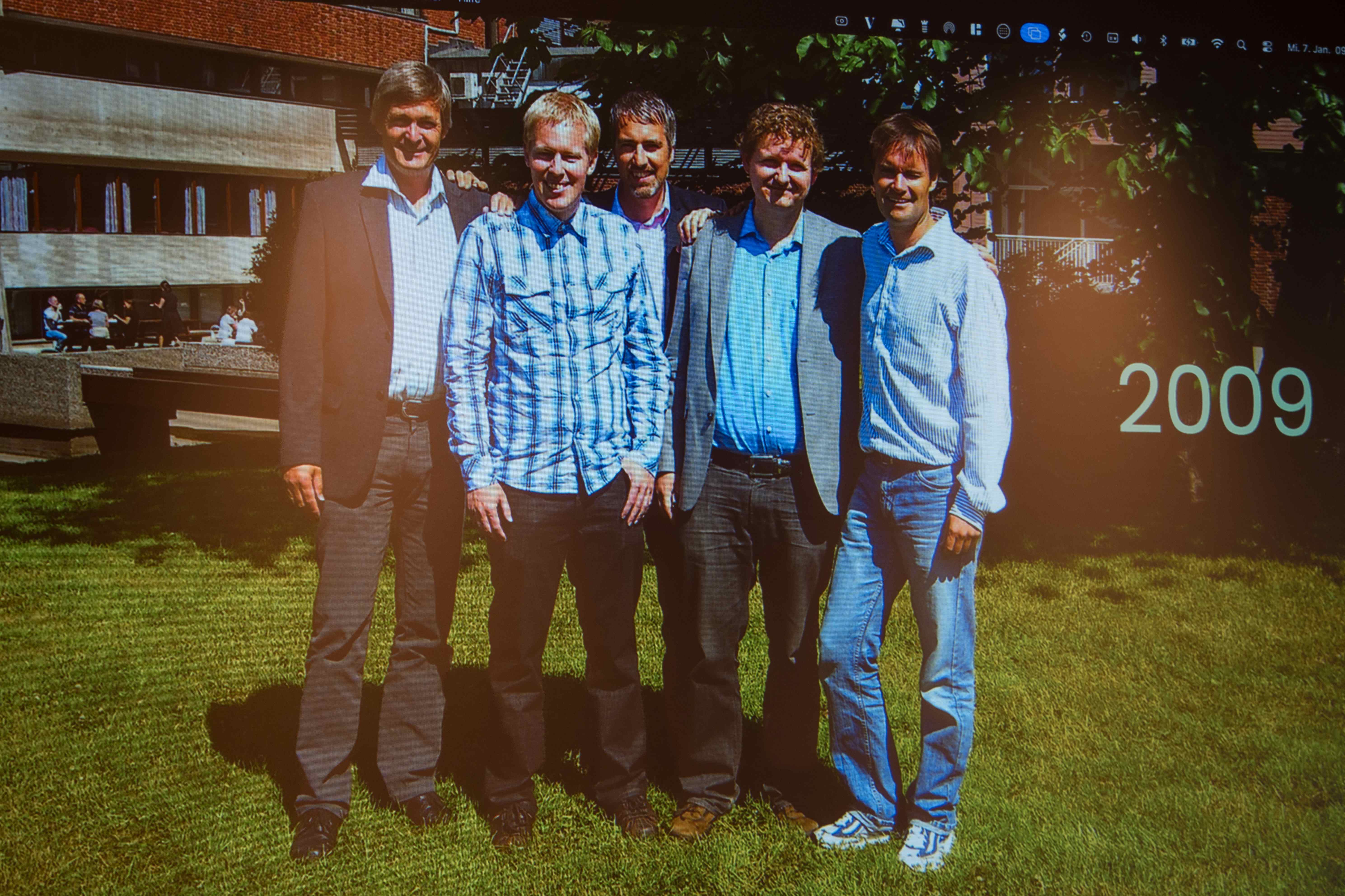 The five Catenda co-founders standing together on a sunny lawn in 2009, the year the company was founded