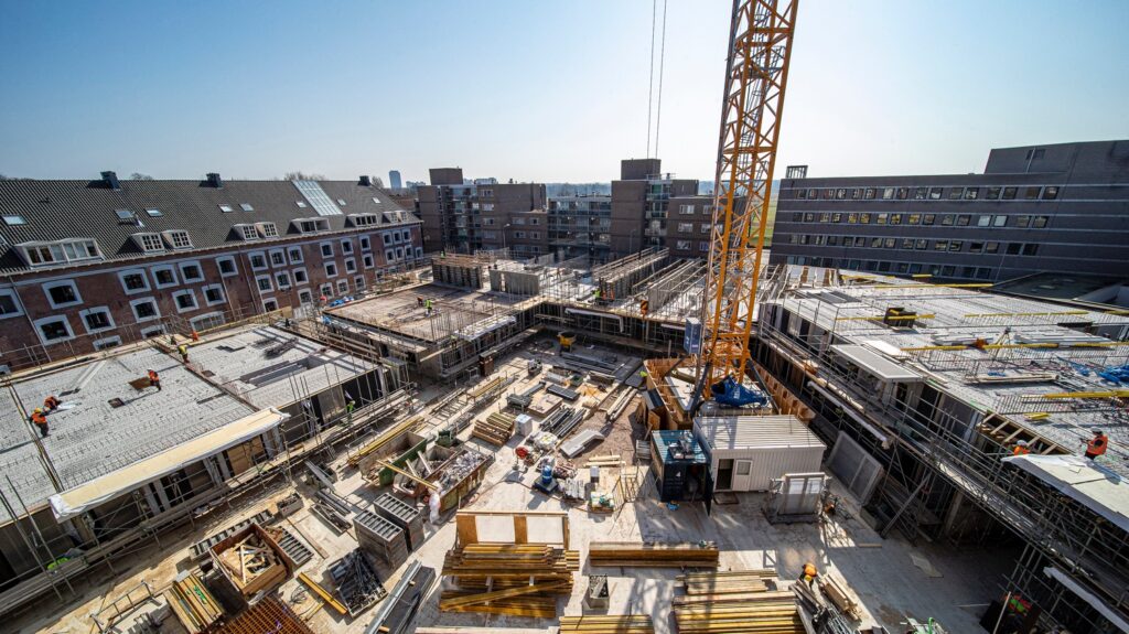 Picture of a construction on site, showing a big area of buildings from the top
