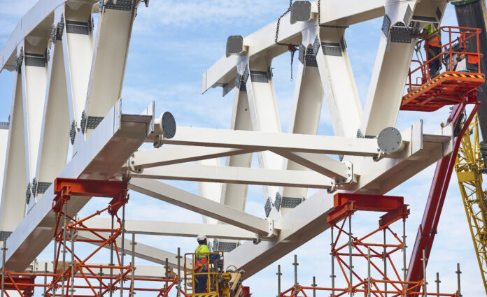 Workers on a construction site. Engineering and architectural infrastructure. Workplace