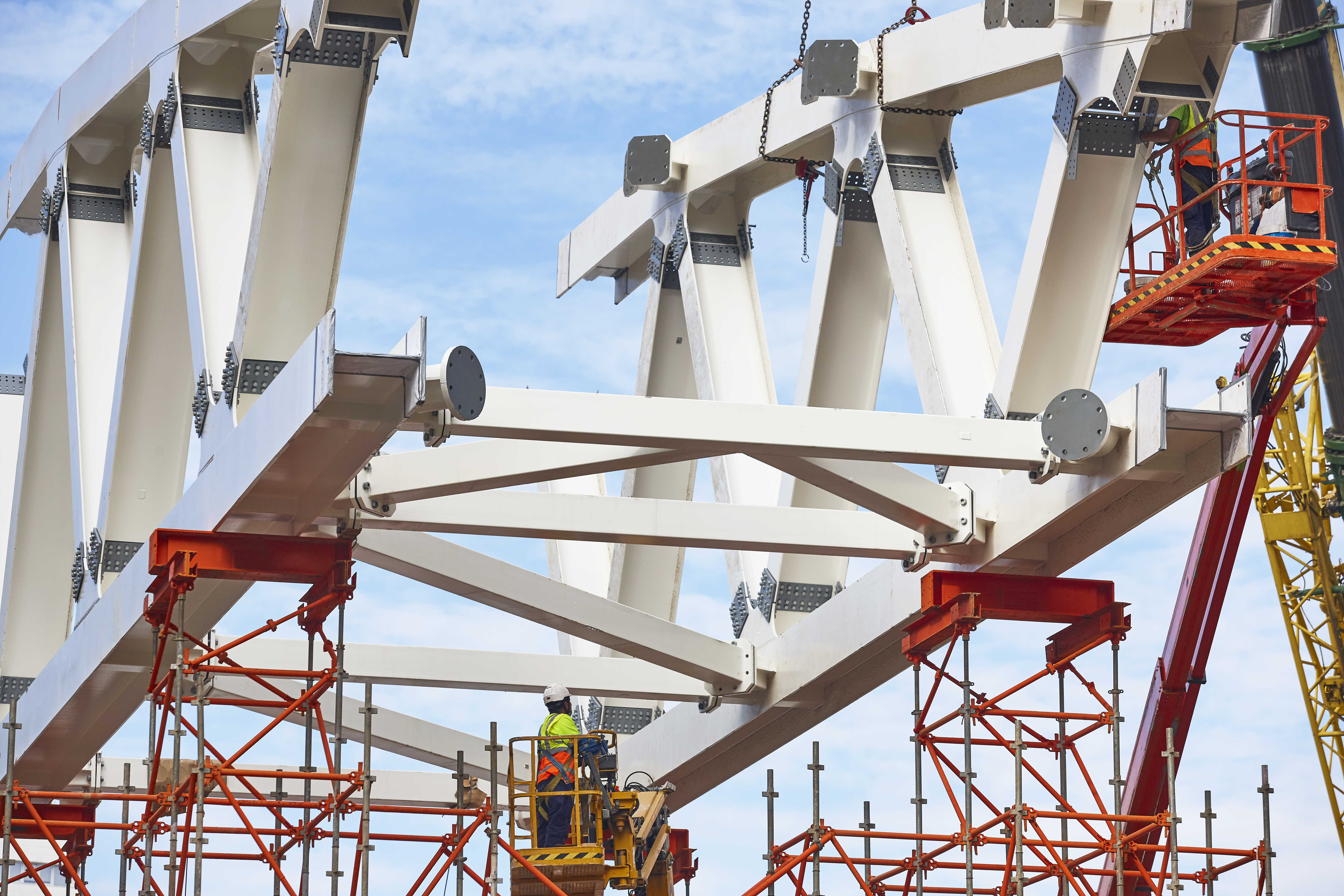 Workers on a construction site. Engineering and architectural infrastructure. Workplace