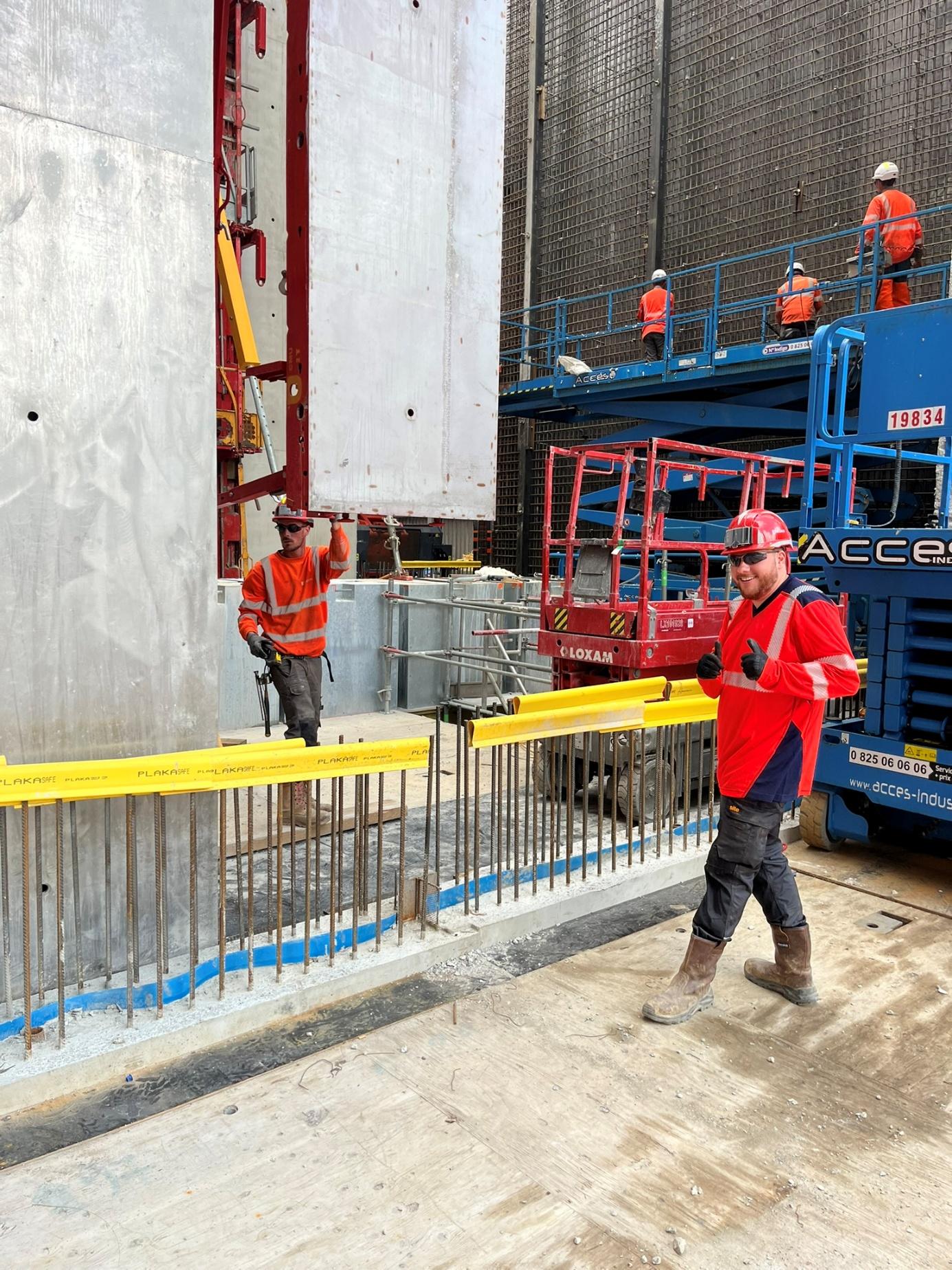 Site crew placing formwork on site